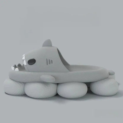 A gray inflatable pool float shaped like a cartoon shark lies on a soft base against a plain gray background—ideal for pairing with CozySteps.uk’s Unisex Shark-Pattern EVA Flip-Flops (US 6–12).